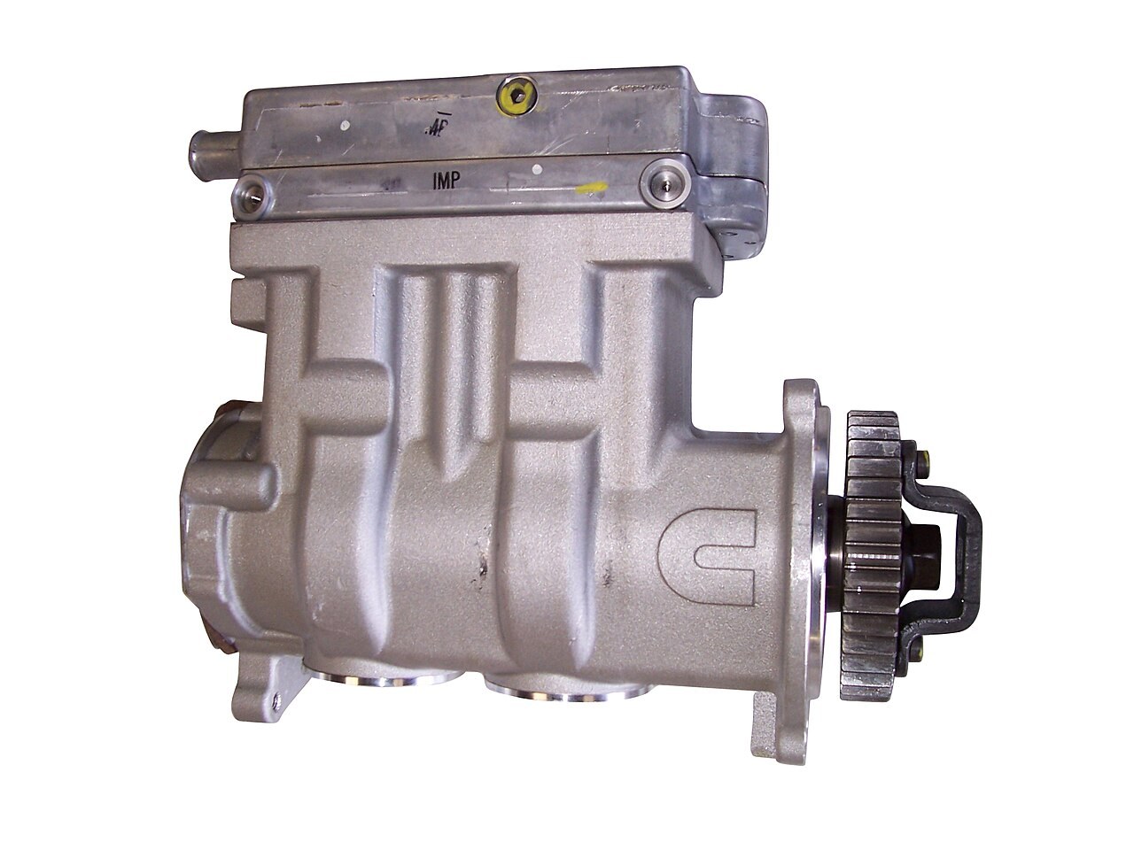 A truck air compressor with its gear drive; it compresses the air for the brake system and pushes moisture and oil into the tanks with it